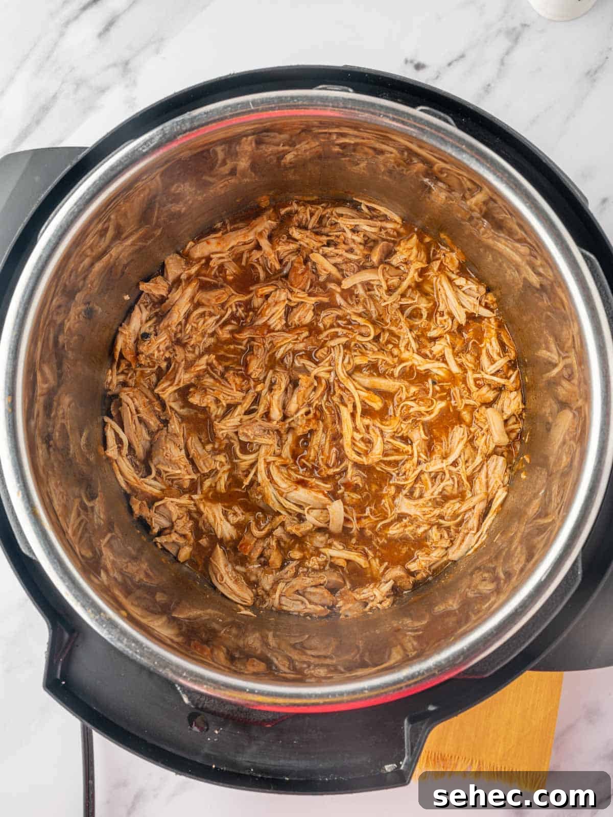 BBQ Pulled Chicken Burger with Smoky Sauce 6 Shredded chicken with bbq sauce in the bottom of an instant pot.
