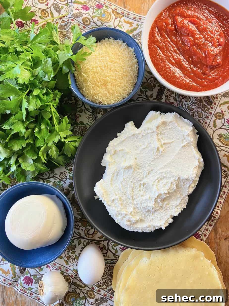 Three Cheese Manicotti Crepes Recipe 3 Ingredients for manicotti crepes on wooden table.
