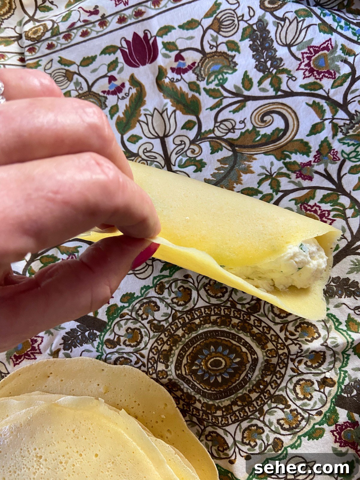 Three Cheese Manicotti Crepes Recipe 7 Rolled and filled manicotti crepe.