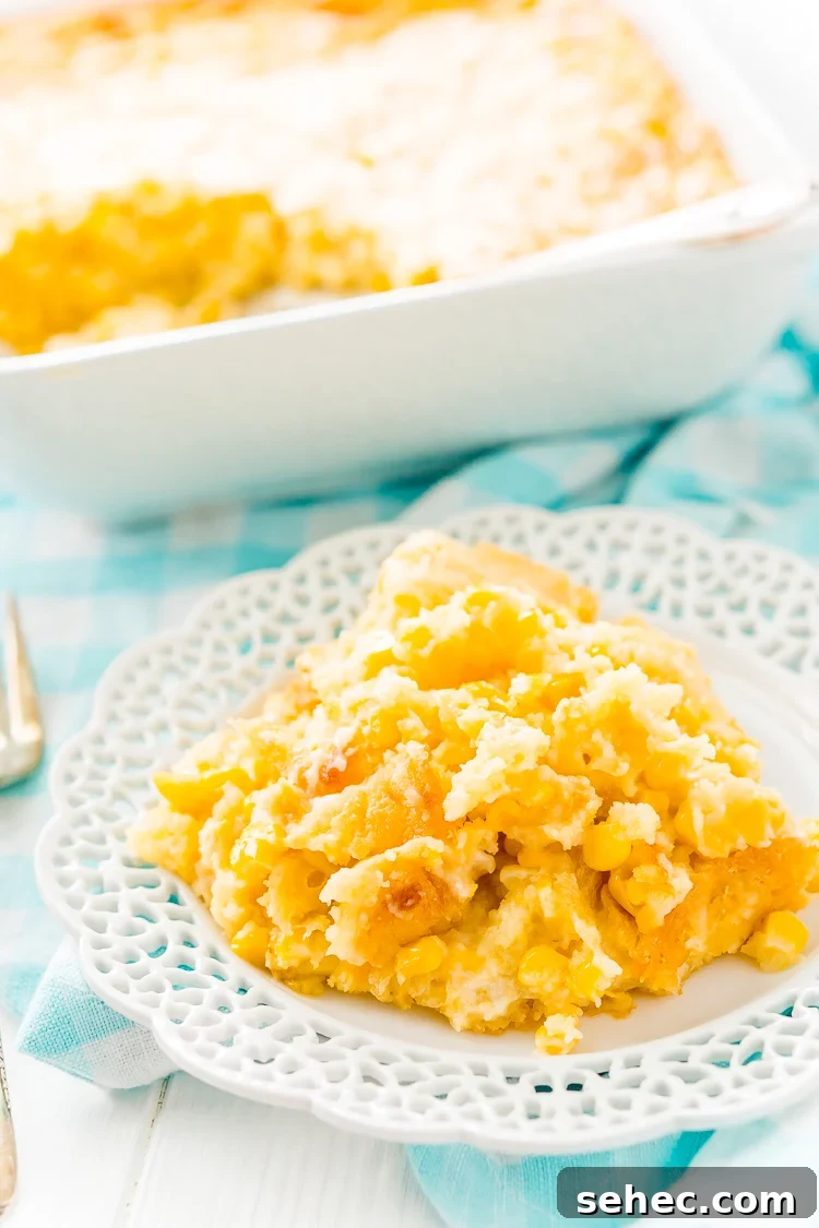 Warm cheesy corn casserole served as an easy holiday side dish.
