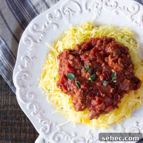 January Vegetarian Meal Plan Week 4 3 Spaghetti squash pasta topped with a tomato sauce with plant-based meat.