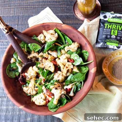 January Vegetarian Meal Plan Week 4 6 A salad bowl of warm roasted cauliflower, mushroom and tomato salad tossed with baby spinach, and dressed with a roasted mushroom vinaigrette.