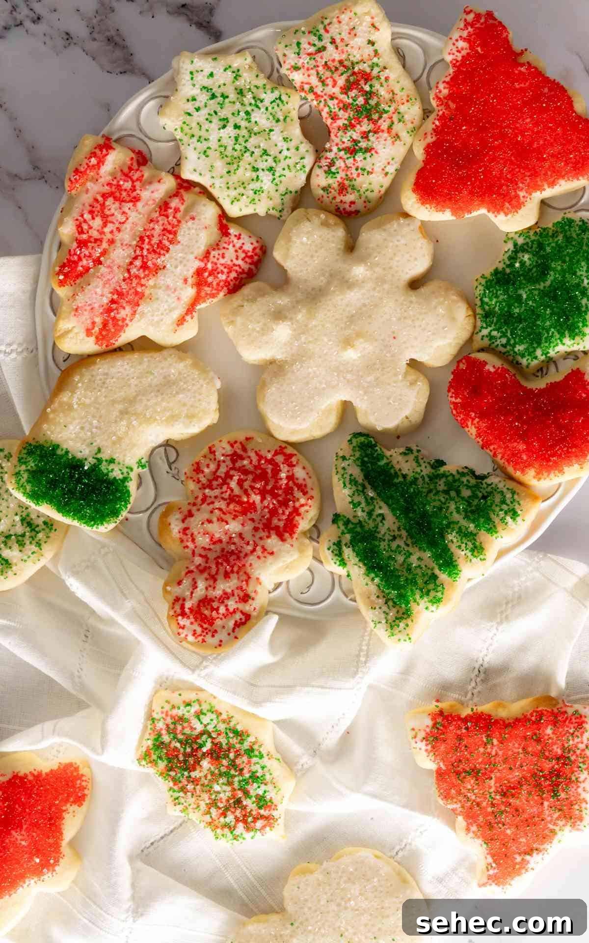 Soft Cream Cheese Sugar Cookies From Scratch 4 Birds eye view of cream cheese sugar cookies for Christmas on decorative plate.