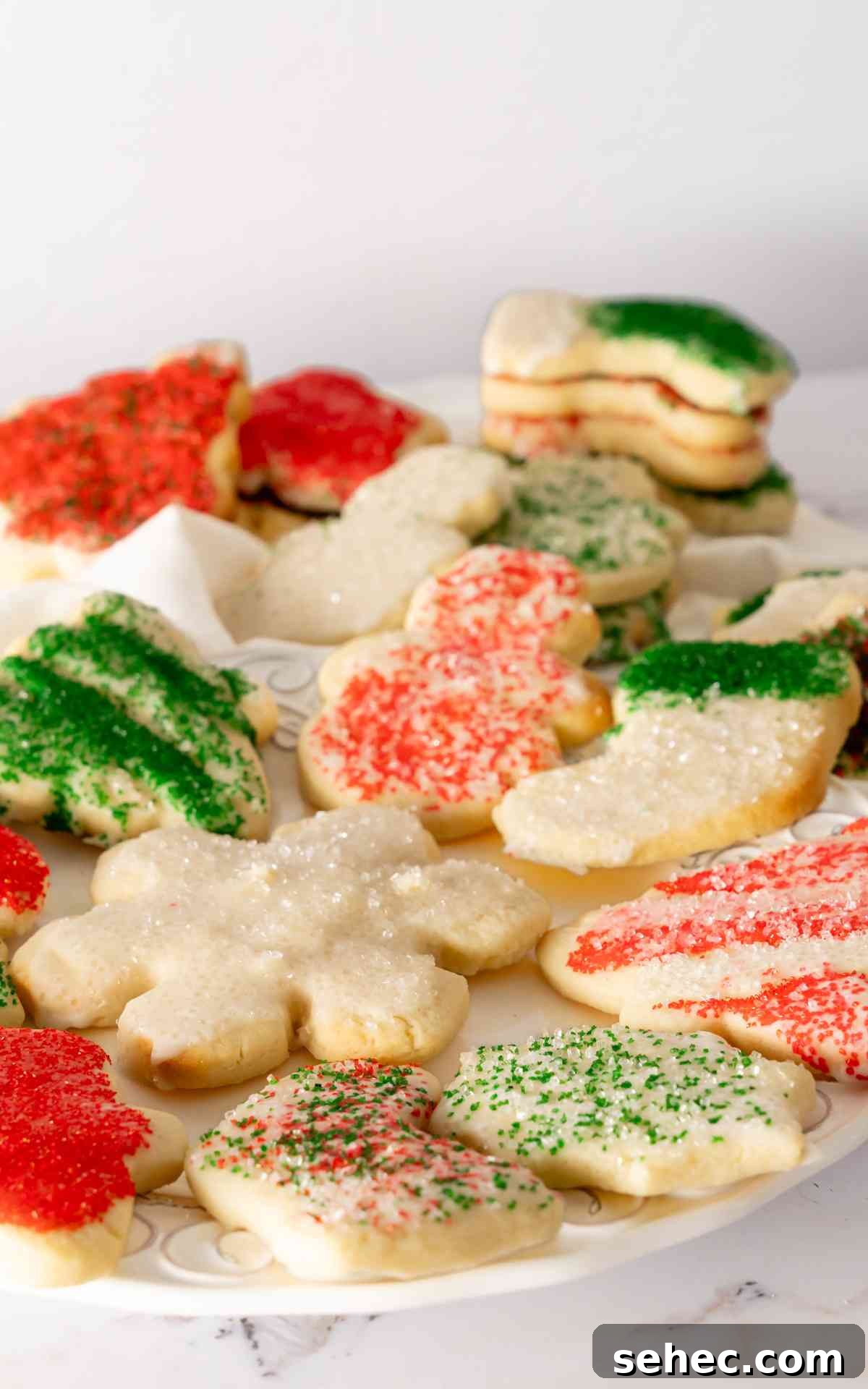 Soft Cream Cheese Sugar Cookies From Scratch 6 Sugar cookie cut outs for Christmas with red and green icing.