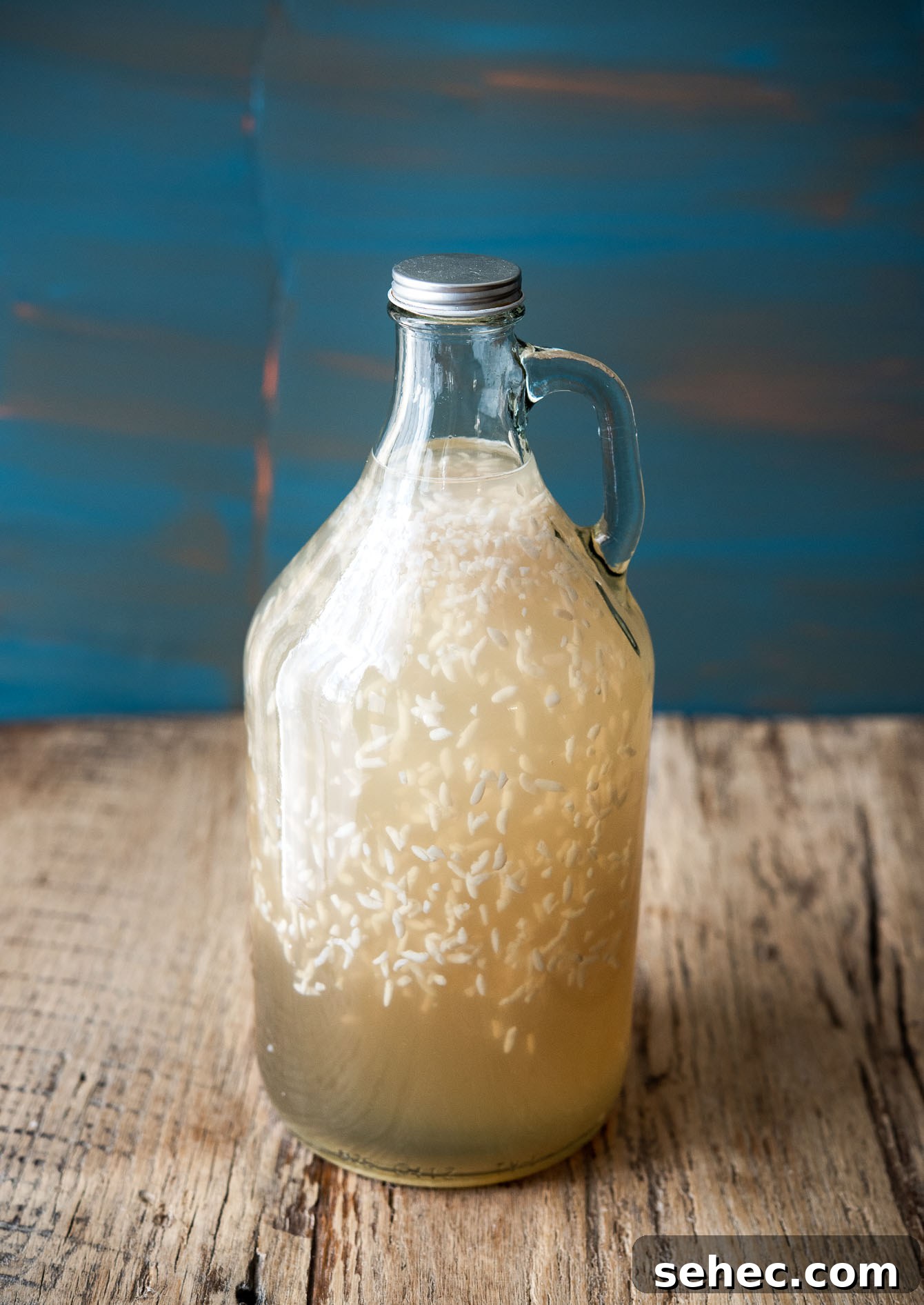 Homemade Sikhye Korean Sweet Rice Drink Recipe 3 Homemade Korean rice drink sikhye in a glass bottle