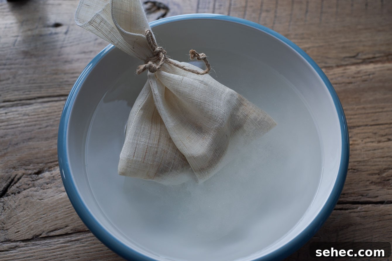 Homemade Sikhye Korean Sweet Rice Drink Recipe 6 A linen pouch holding malt barley in water
