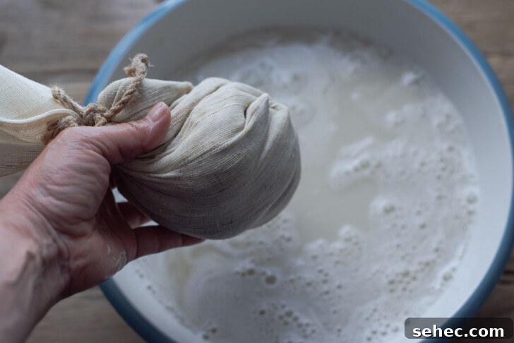 Homemade Sikhye Korean Sweet Rice Drink Recipe 8 Barley malt pouch squeezed to release liquid for sikhye