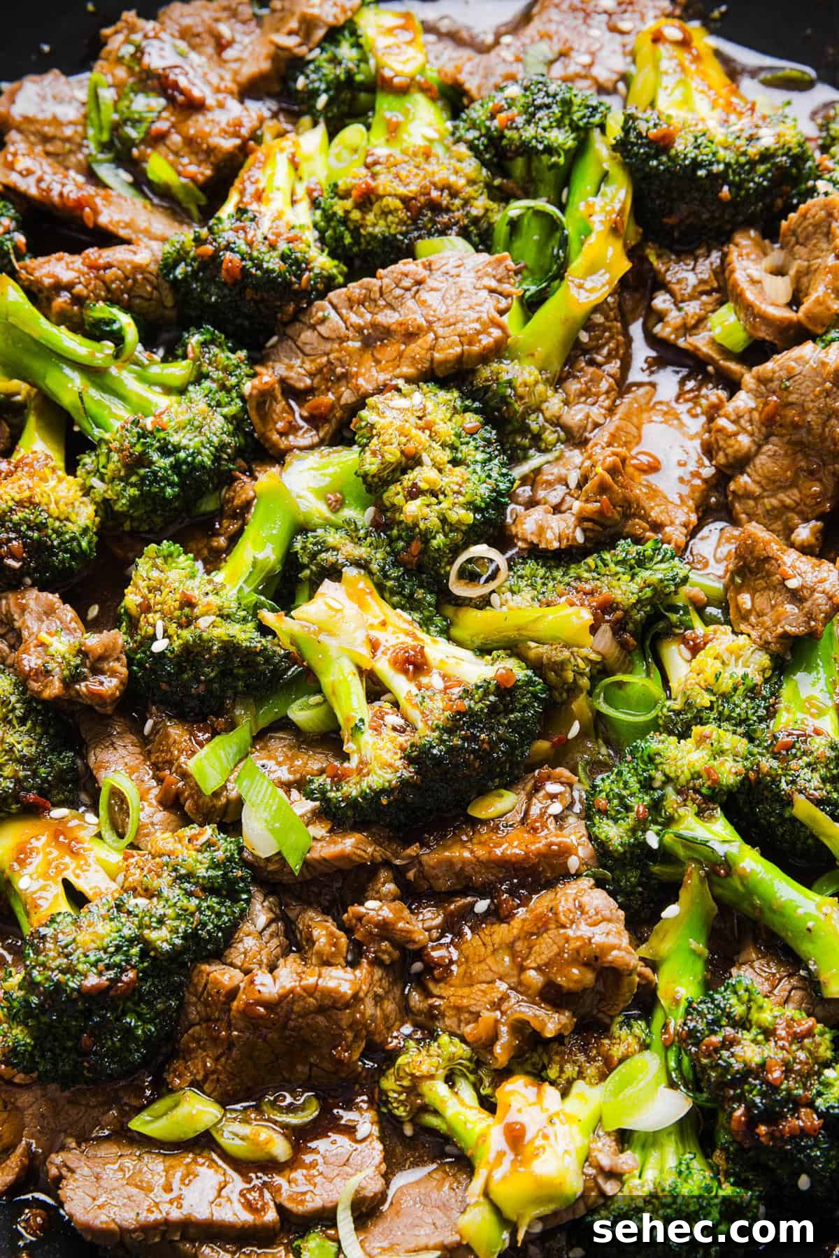Beef and Broccoli Stir Fry Recipe 6 Beef and broccoli cooking in a skillet with garlic ginger sauce.