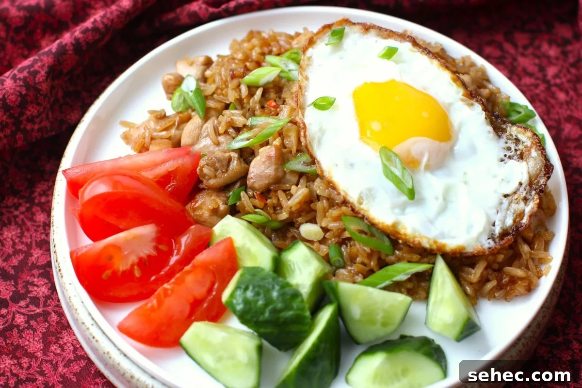 Nasi Goreng Indonesian Fried Rice Recipe 7 Plate of nasi goreng with a fried egg on top.