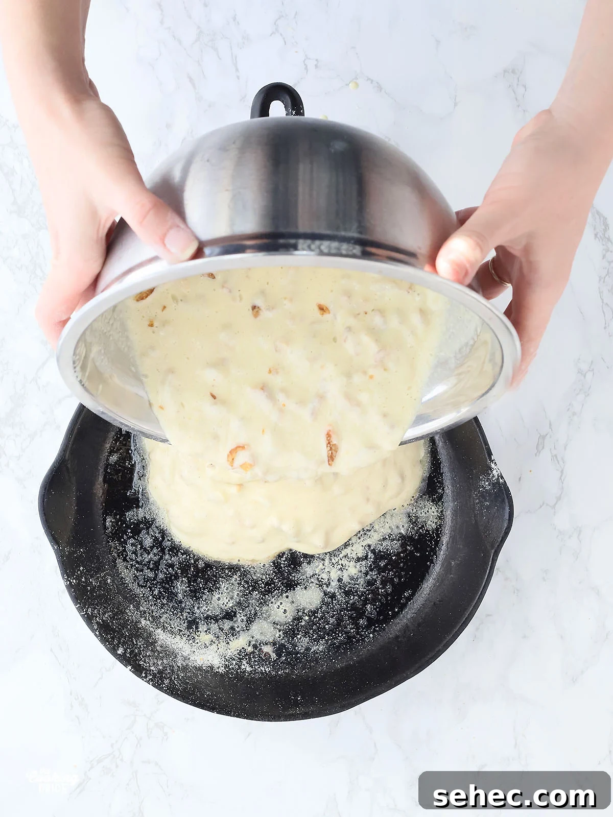 Southern Cracklin Cornbread Recipe 13 hands pouring cracklin' corn bread batter into a cast iron skillet