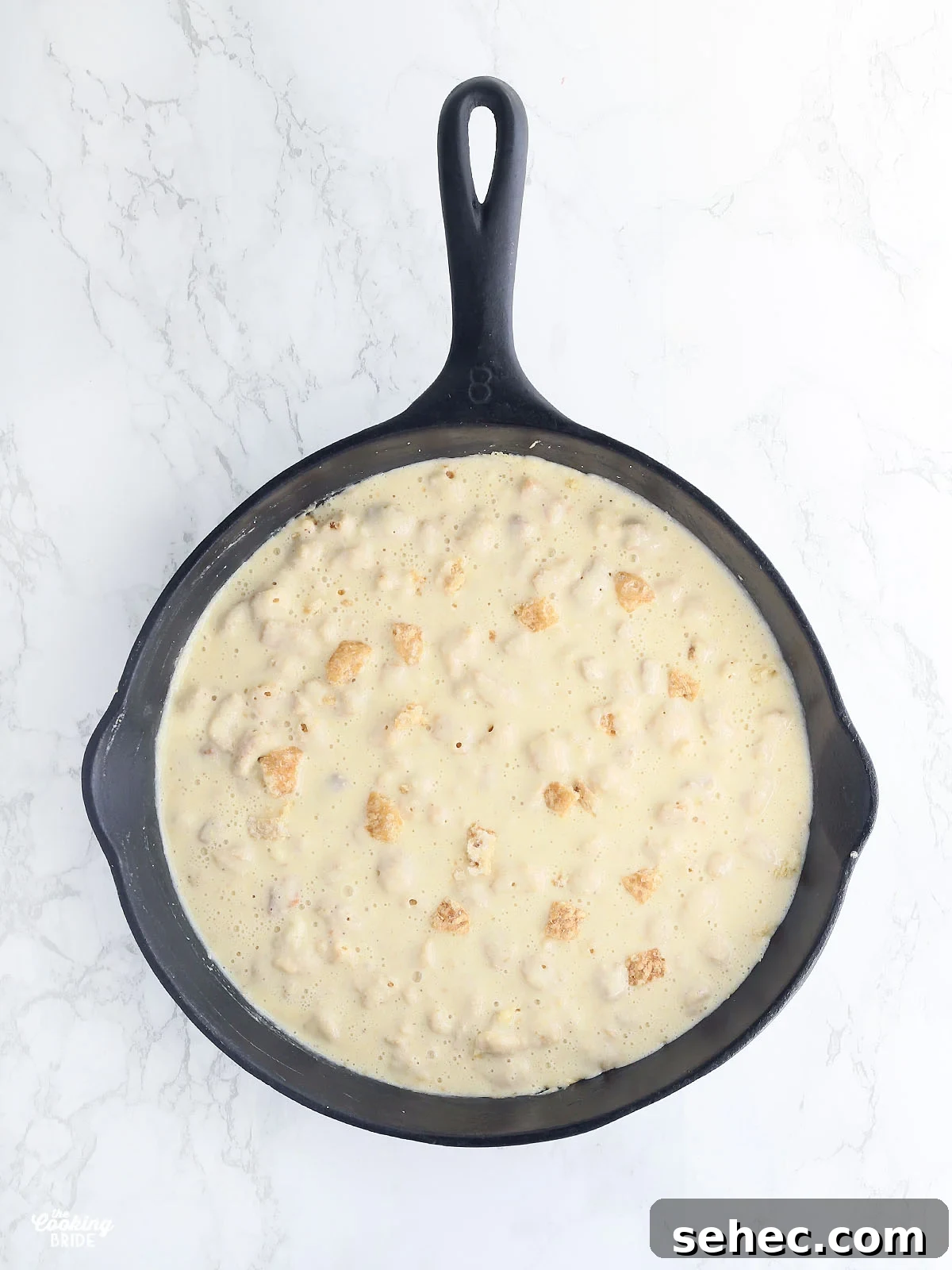 Southern Cracklin Cornbread Recipe 14 overhead shot of cracklin' corn bread batter in a cast iron skillet