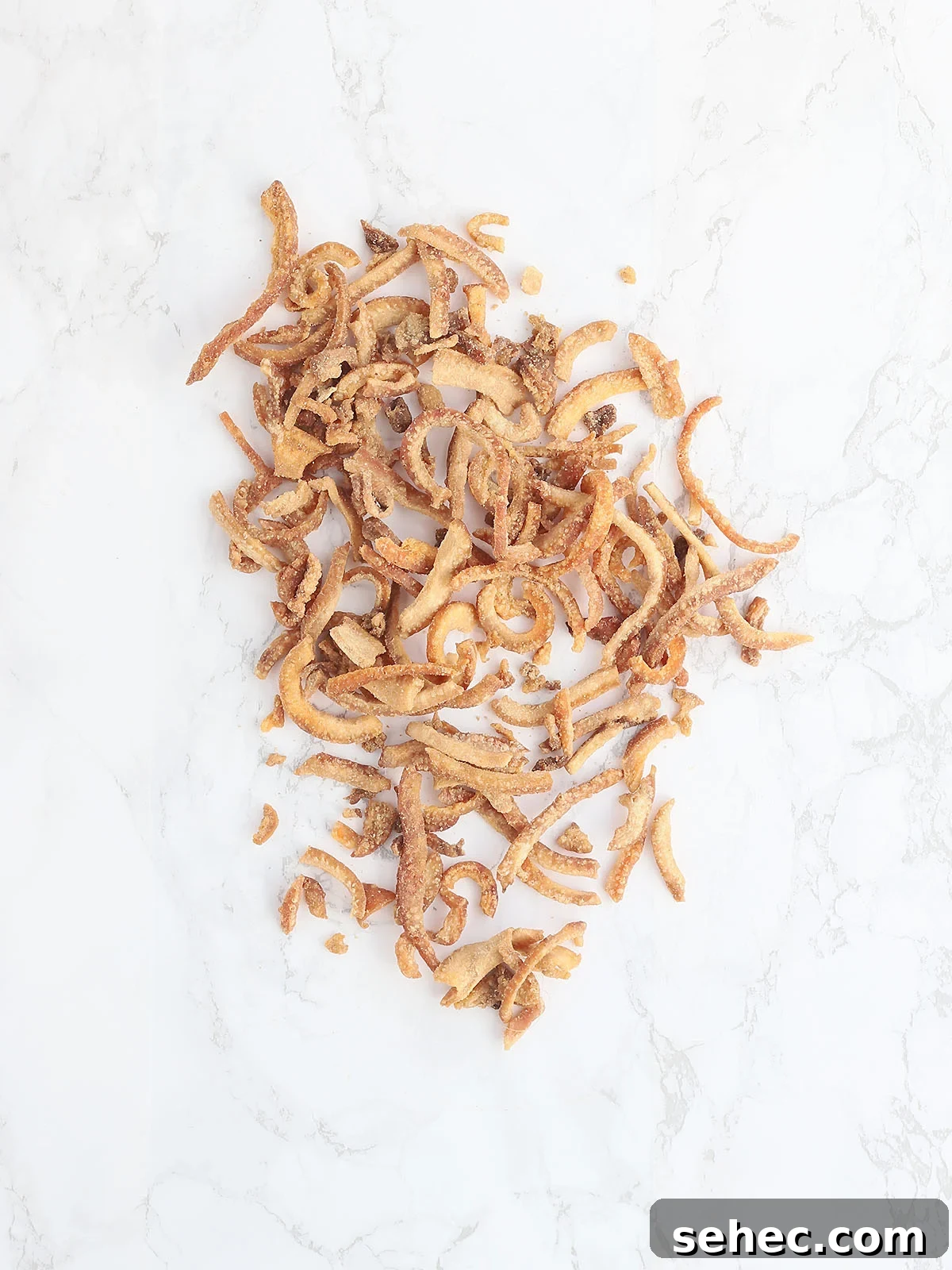Southern Cracklin Cornbread Recipe 4 hard pork cracklins on a white background