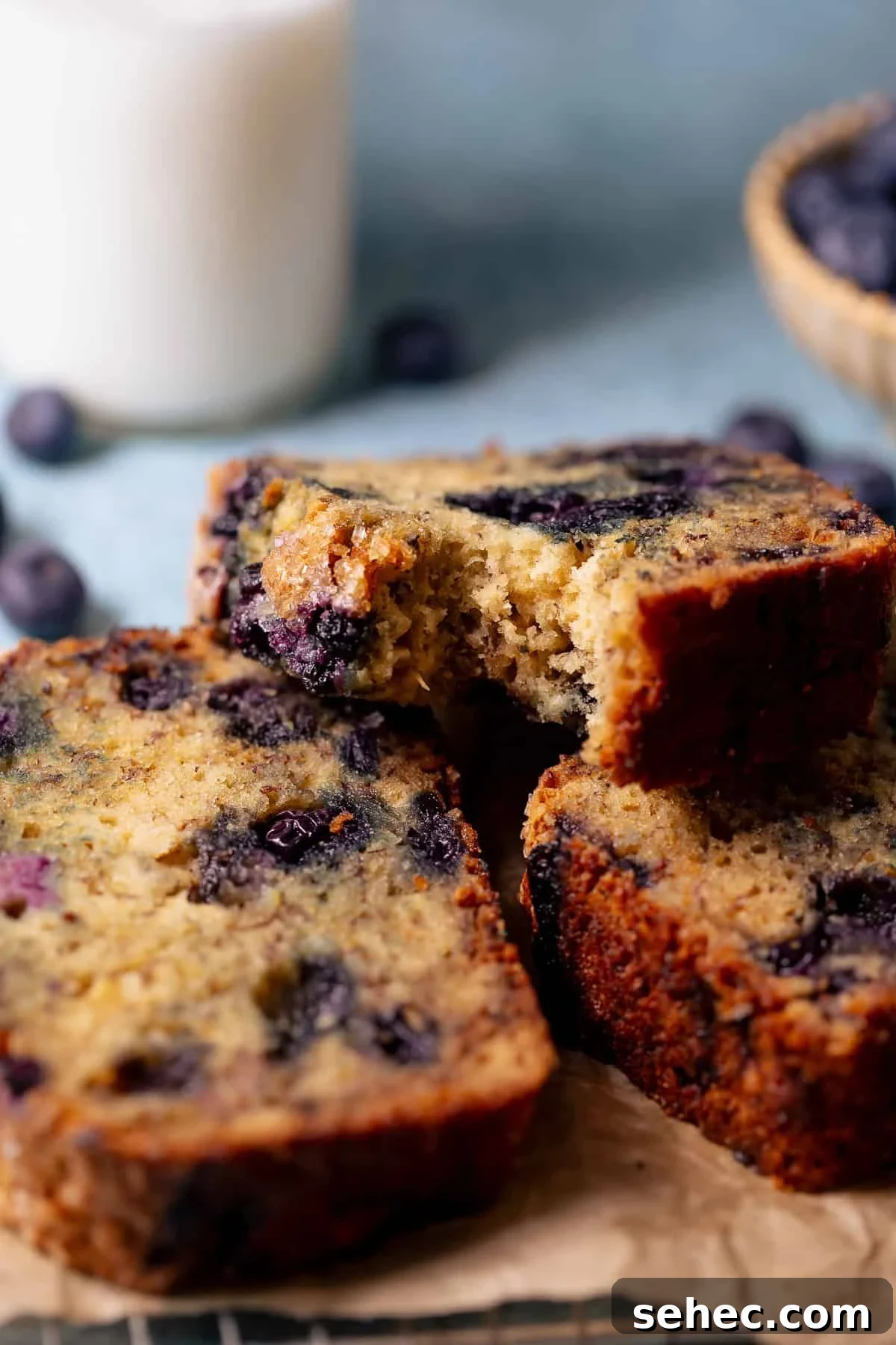 Sugar Crusted Blueberry Banana Bread 7 Close-up of a slice of blueberry banana bread showing a moist, tender crumb.