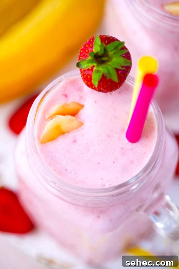 Creamy Strawberry Banana Smoothie Recipe 7 Overhead shot of a glass with strawberry banana smoothie.