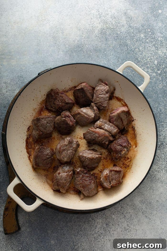 Slow Cooker Beef and Barley Stew Recipe 5 Chunks of stew meat browned in a dutch oven