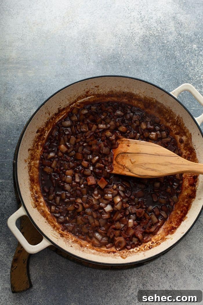 Slow Cooker Beef and Barley Stew Recipe 6 Onions and garlic sauteed with red wine in a dutch oven