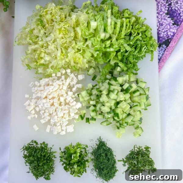 Maroulosalata Greek Green Salad with Fresh Herbs 3 simple green ingredients on white cutting board