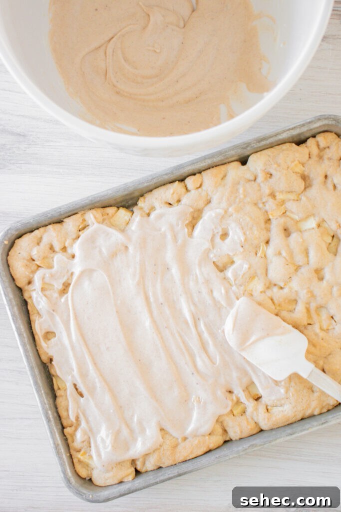 Apple Bars with Pumpkin Pie Spice Glaze 9 Apple Bars with Pumpkin Pie Spice Icing with spatula