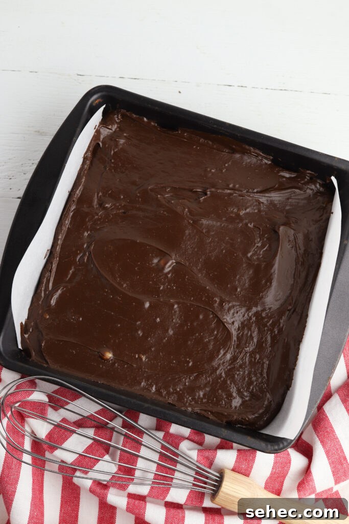 Homemade Peppermint Fudge Recipe in the Microwave 11 Chocolate fudge mixture spread in a pan