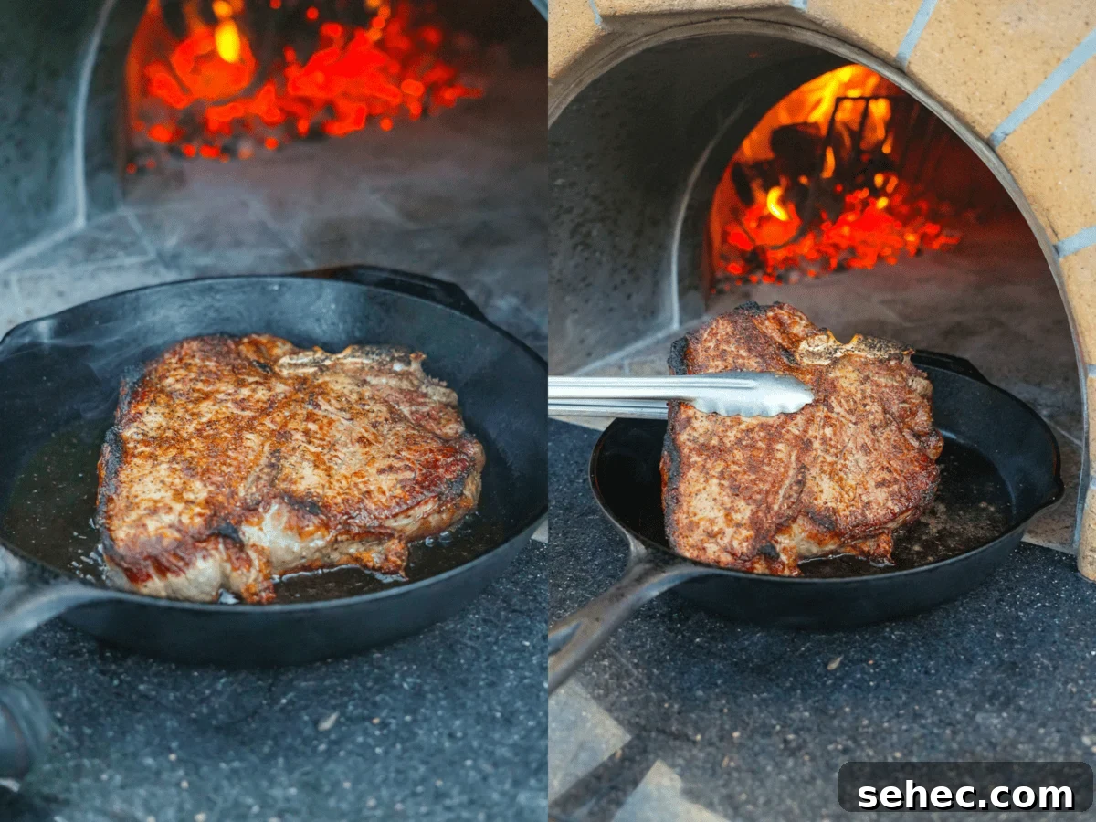 Peter Luger Surf and Turf Steak and Lobster Recipe 6 Searing the seasoned Peter Lugar steak on a hot skillet by the fire.