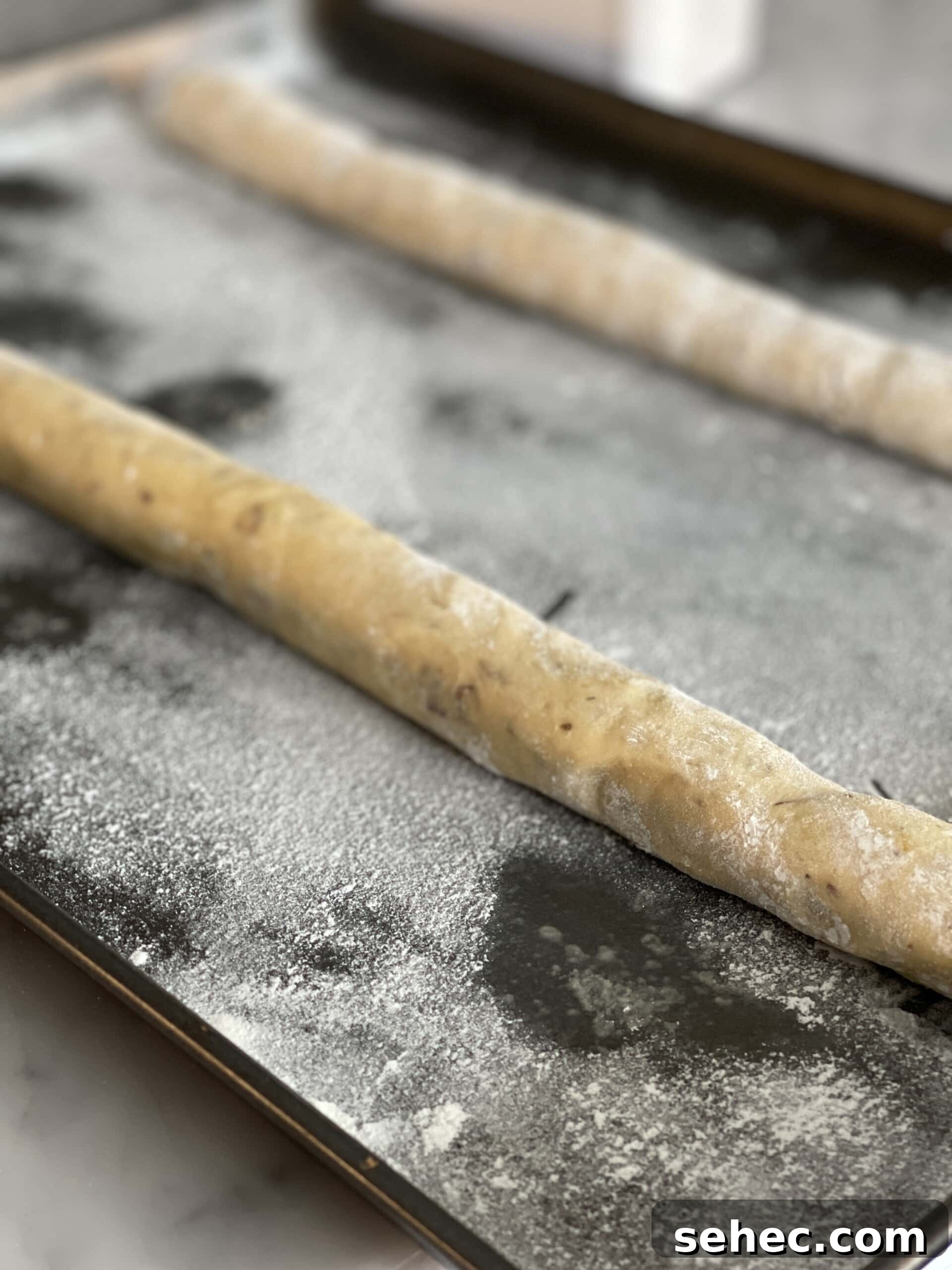 Mom's Almond Biscotti Recipe 15 biscotti logs on baking sheet