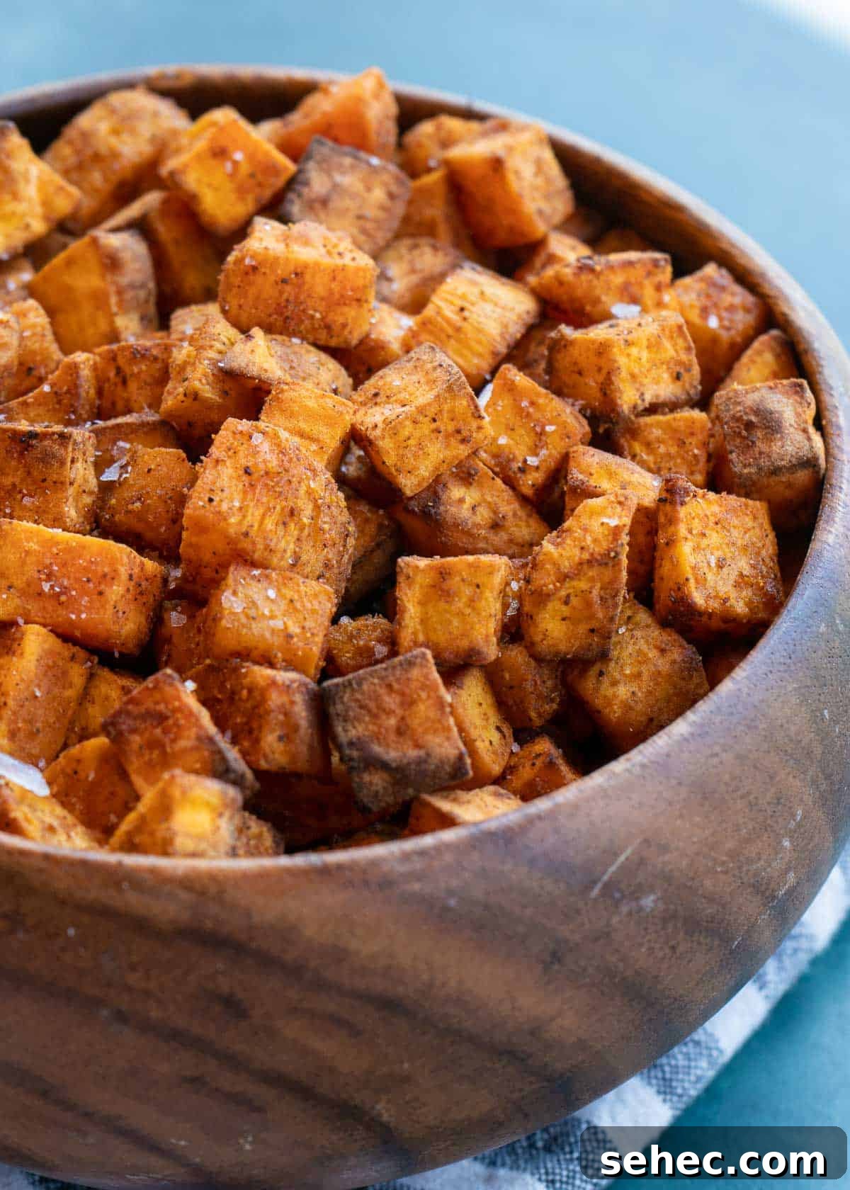 Crispy Air Fryer Sweet Potato Cubes 2 sweet potatoes in a bowl