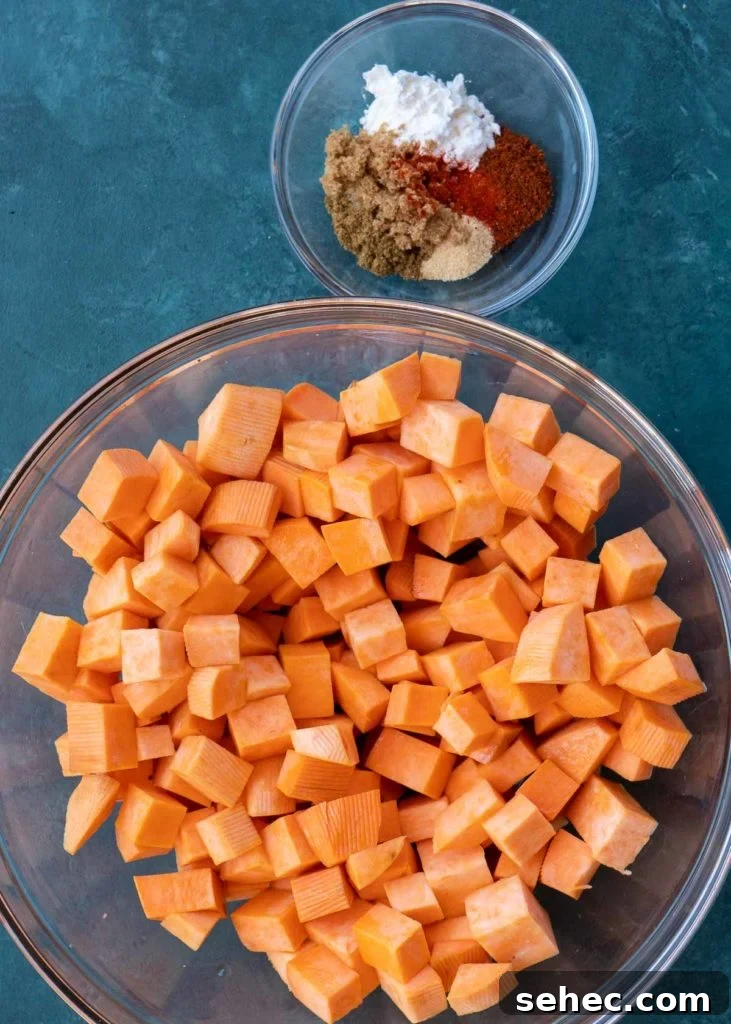 Crispy Air Fryer Sweet Potato Cubes 7 overhead shot of sweet potatoes and spices