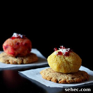 Halwa balls on crackers, served on white plates