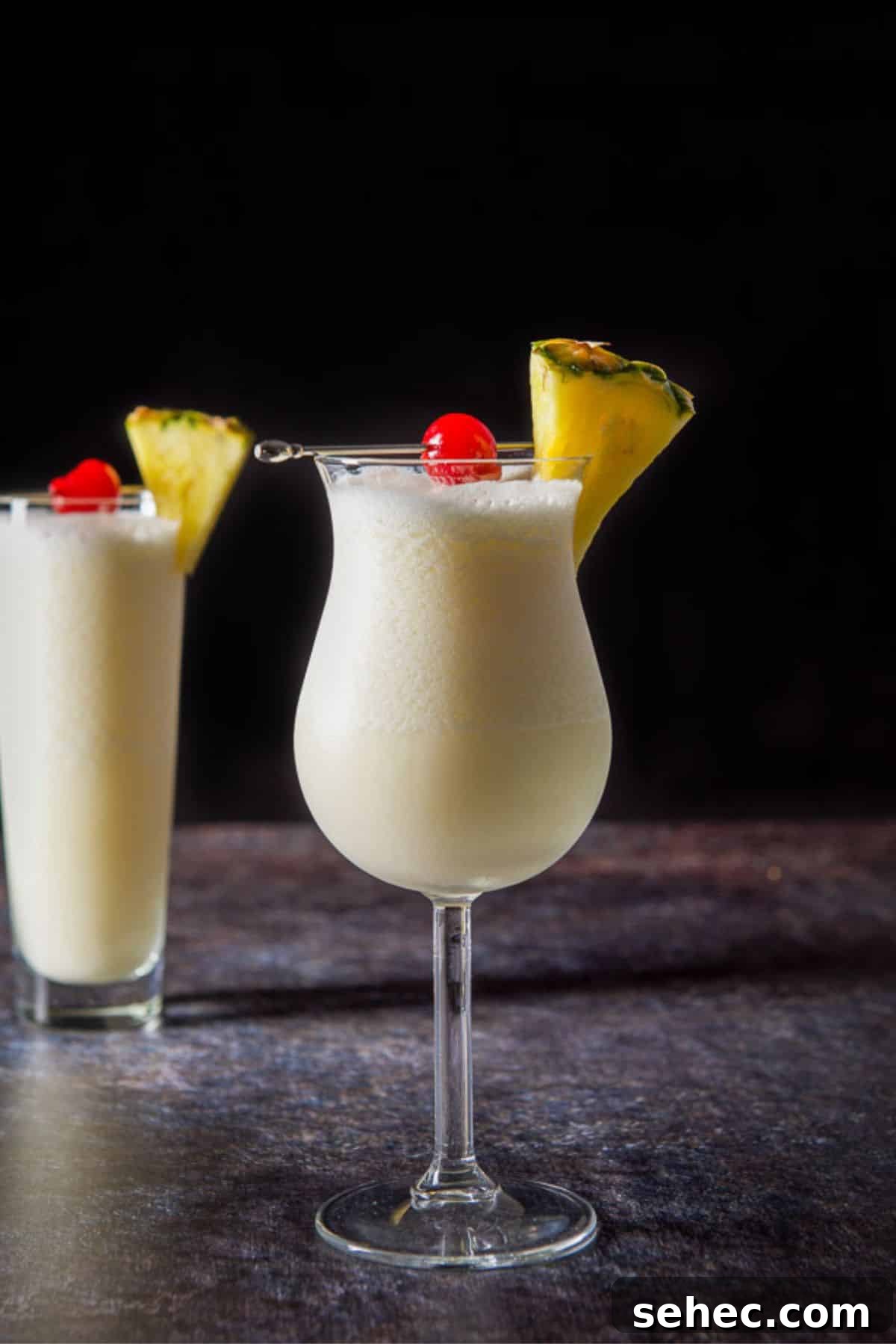 Vertical view of the piña colada cocktail in two glasses