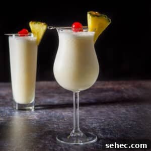 Vertical view of the piña colada cocktail in two glasses