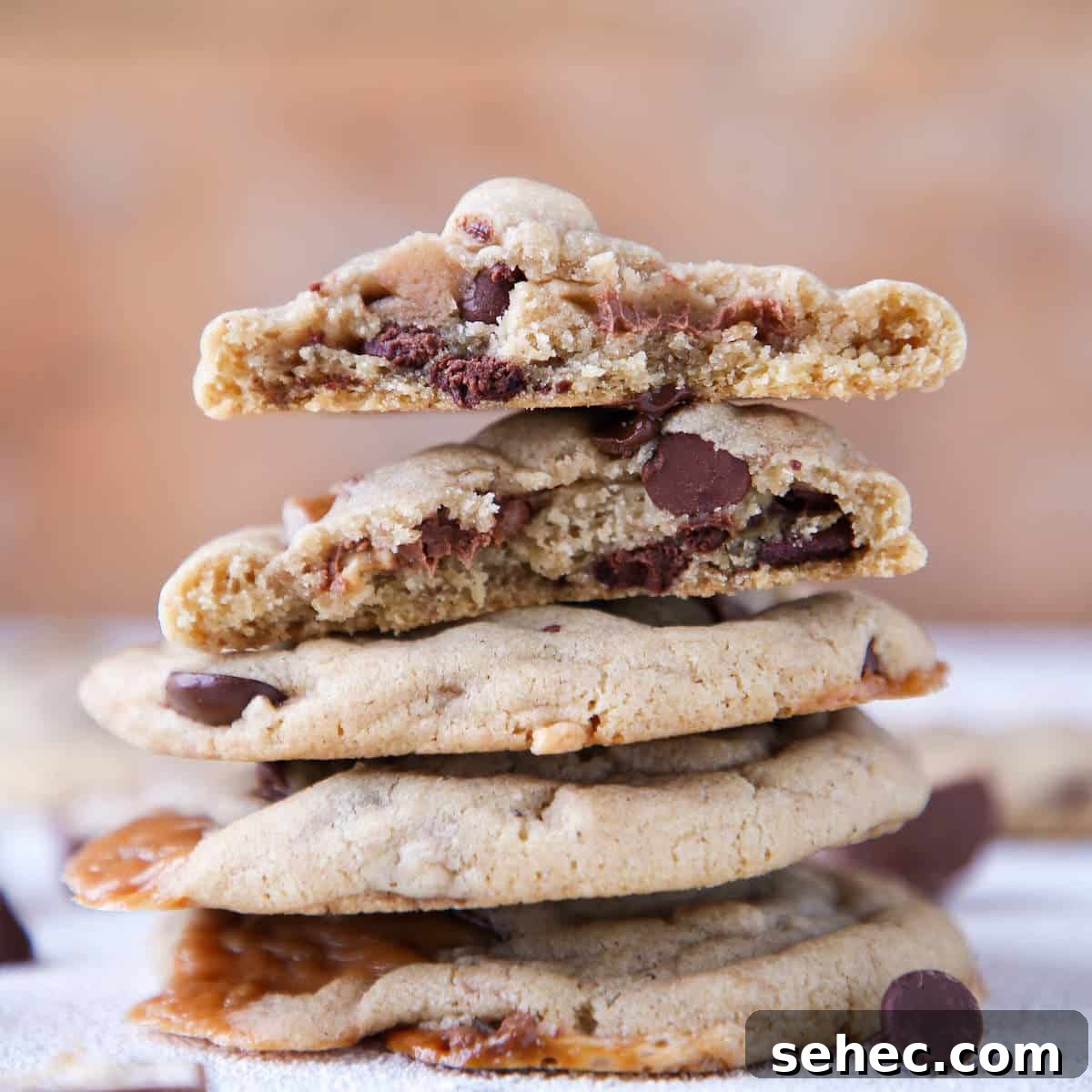 Brown Butter Snickers Cookies Stuffed With Caramel 3 Caramel Stuffed Brown Butter Snickers Chocolate Chip Cookies stacked interior detail