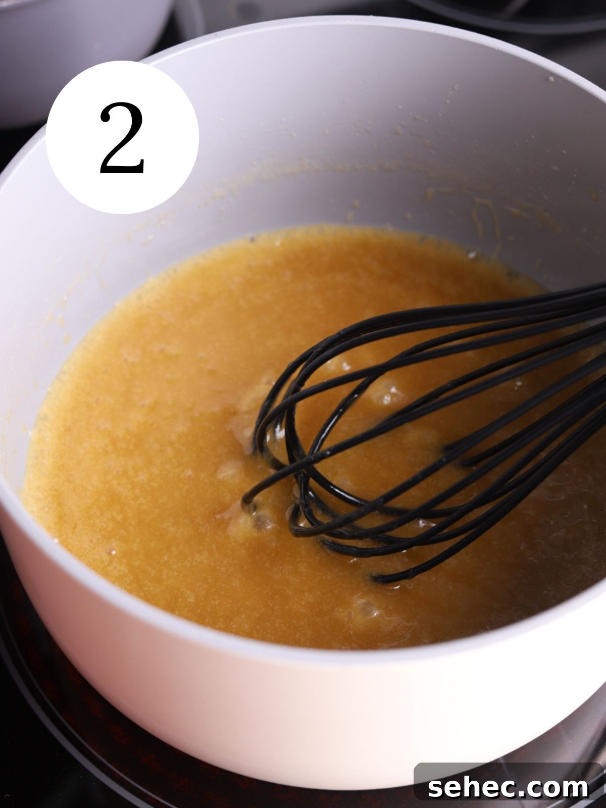 Christmas Crack Saltine Cracker Toffee Recipe 5 Toffee mixture being whisked in a saucepan
