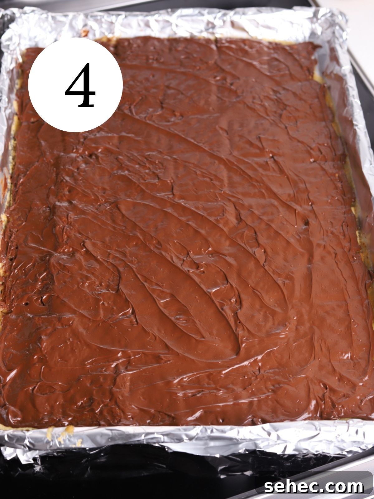 Christmas Crack Saltine Cracker Toffee Recipe 7 Melted chocolate spread over Christmas Crack