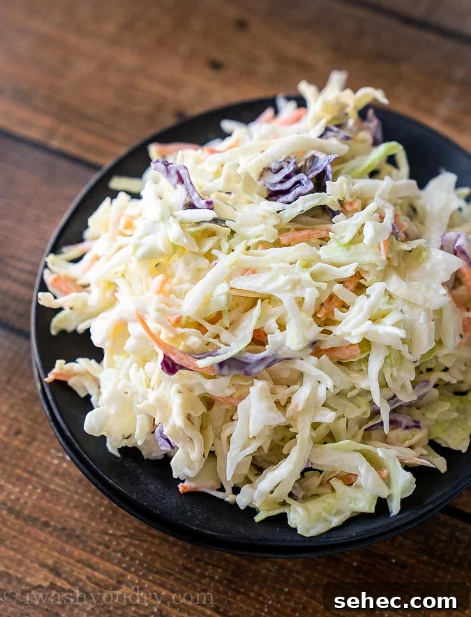 Black plate filled with creamy Coleslaw recipe. 