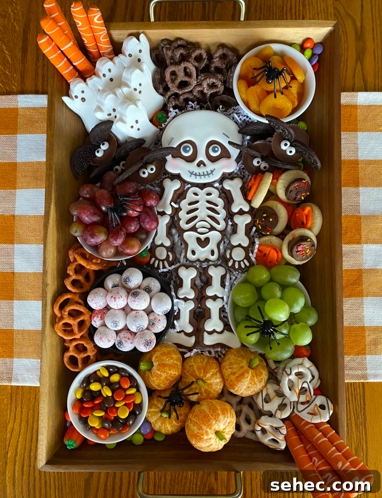 Halloween Charcuterie Board 2 Halloween Char-BOO-terie dessert board with candy, cookies, fruit, and nuts