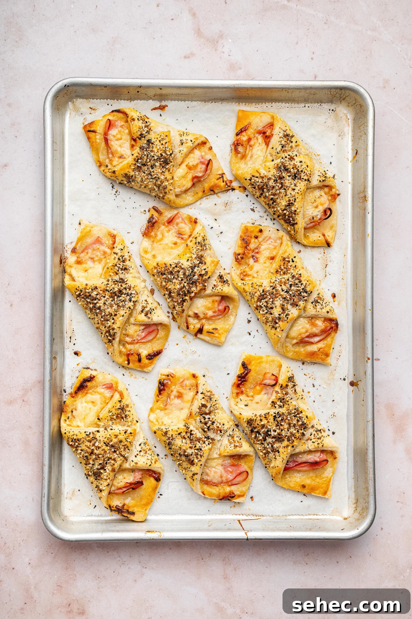 Ham and Cheese Puff Pastry Bundles Ham and cheese puff pastry bundles baking in the oven