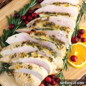 Roasted Turkey Breast with Honey Butter Glaze 6 A sliced turkey breast is presented with rosemary and cranberries.