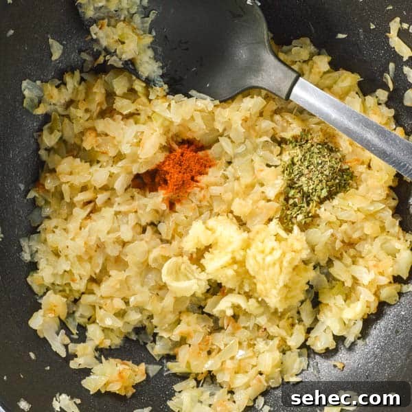 Zucchini Marinara Recipe 5 Close up on diced onions with some herbs and spices