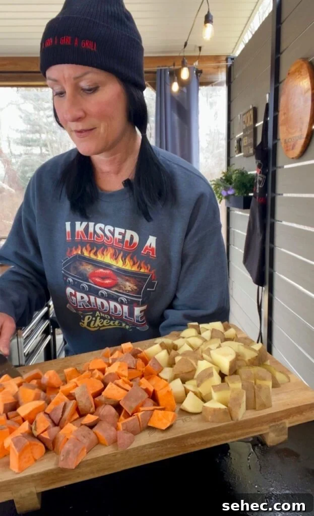 Blackstone Taco Meal Prep with Grilled Veggies 3 adding potatoes to the griddle