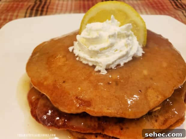 Gingerbread Pancakes In Lemon Sauce Gingerbread pancakes in lemon sauce are served with whipped cream and a lemon wedge garnish.