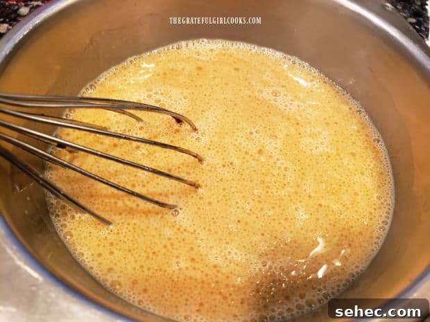 Gingerbread Pancakes In Lemon Sauce Egg, molasses, milk, and oil are combined as the wet ingredients for pancake batter.