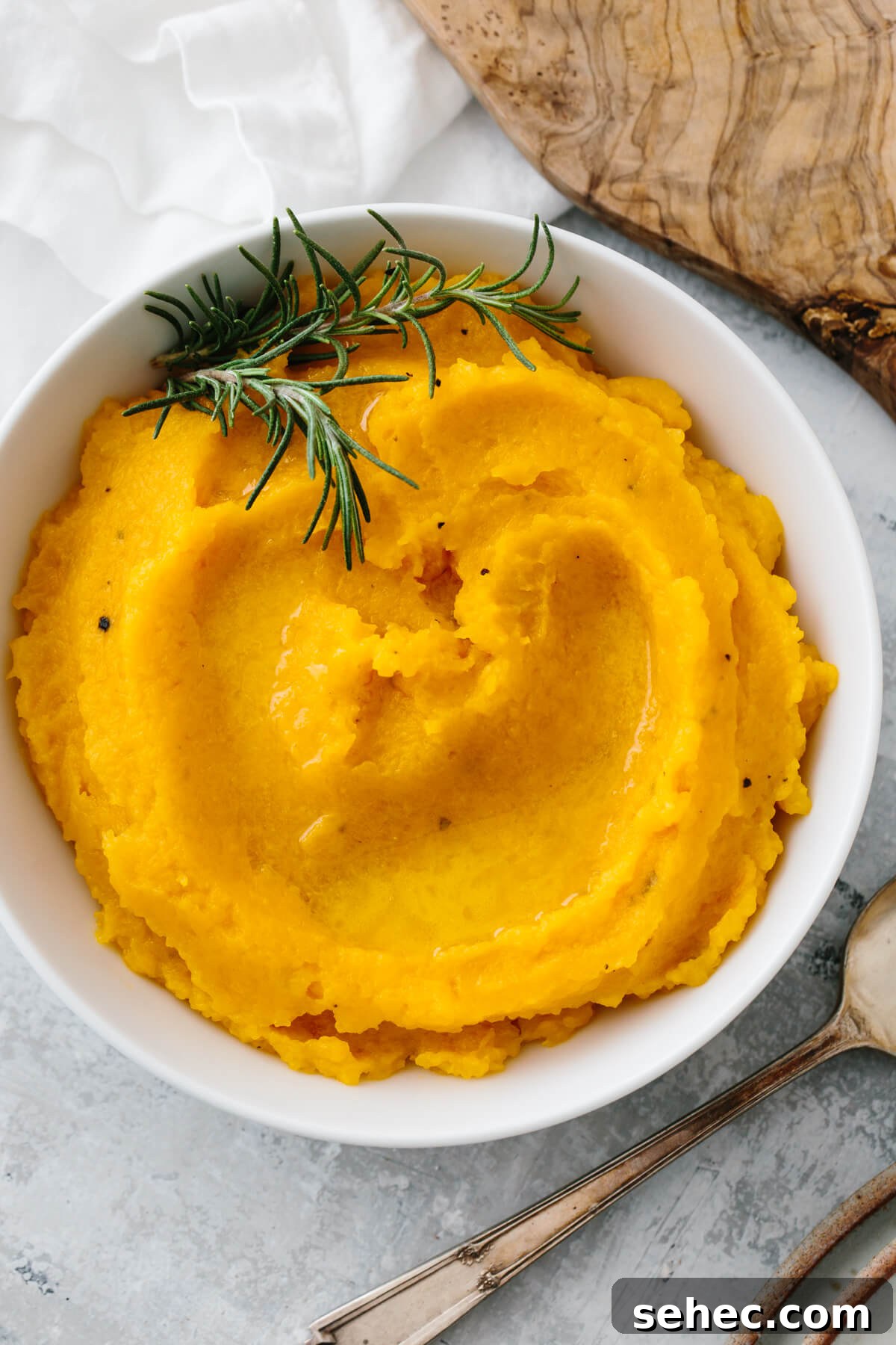 Butternut Squash Recipes for Soups, Sides, and Mains 7 Mashed butternut squash in a white bowl.