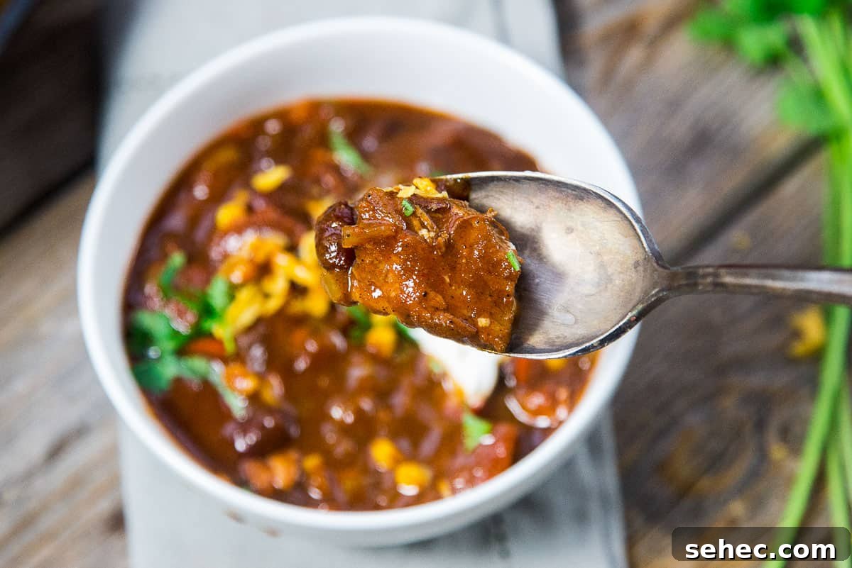 Award Winning Smoked Brisket Chili Recipe with Video 6 Chili in a bowl with a spoonful of brisket