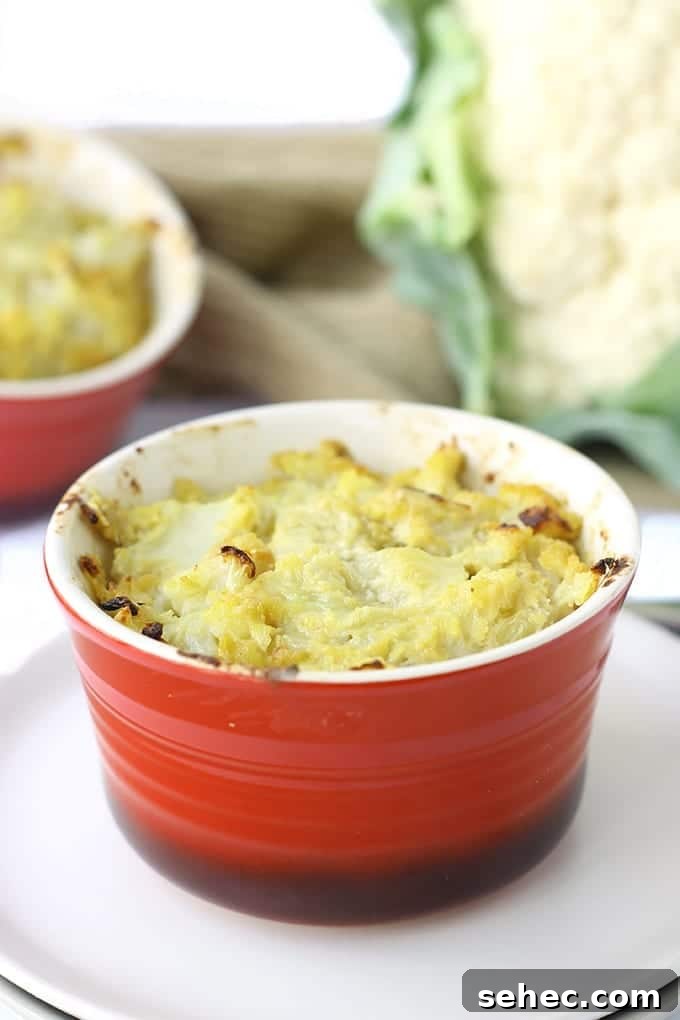 Baked cheesy cauliflower casserole that is dairy-free and paleo-friendly