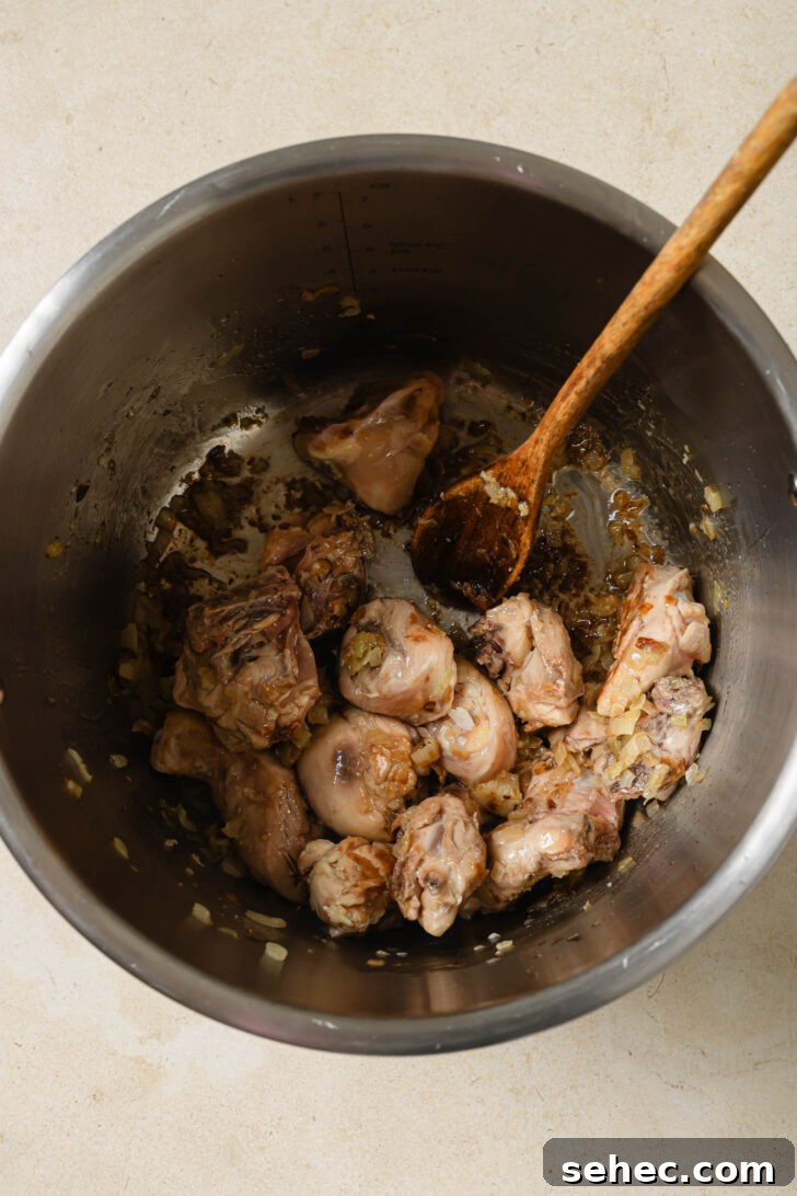 Instant Pot Chicken Curry Recipe 5 Cooking chicken in sautéed onions, ginger and garlic in an Instant Pot.