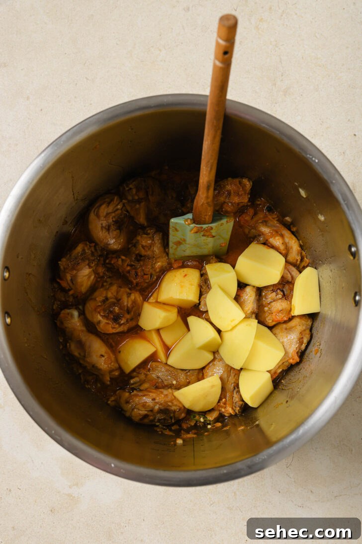 Instant Pot Chicken Curry Recipe 6 Potatoes added to Instant Pot with sautéed chicken to make Chicken Curry.