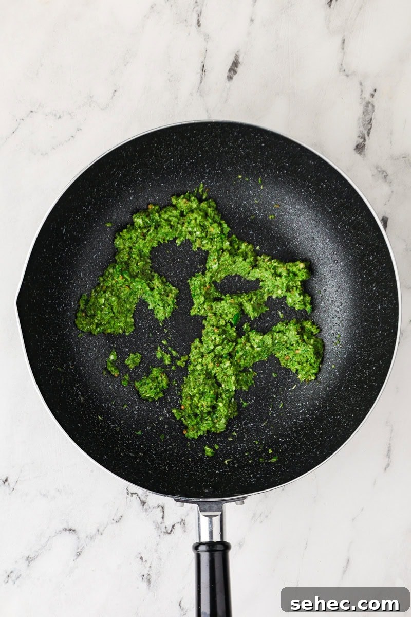 Thai Green Tofu Curry Recipe 8 Green curry paste in a pan.