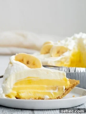 banana pudding pie slice on a white plate
