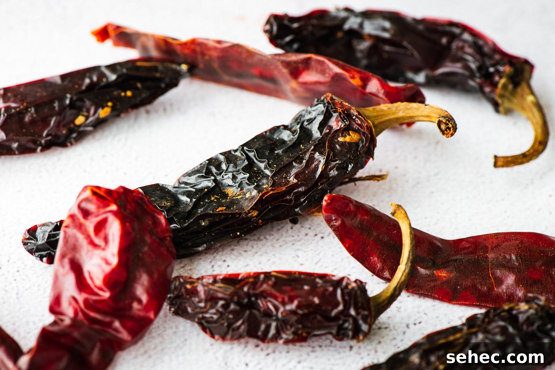 Gochugaru Substitute for Kimchi Stews and More 8 A close-up of dried Jalapeño peppers and red chillies on a concrete background.