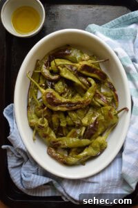 Italian Oven Roasted Green Peppers Recipe 14 overhead view of Italian roasted green peppers on a baking sheet